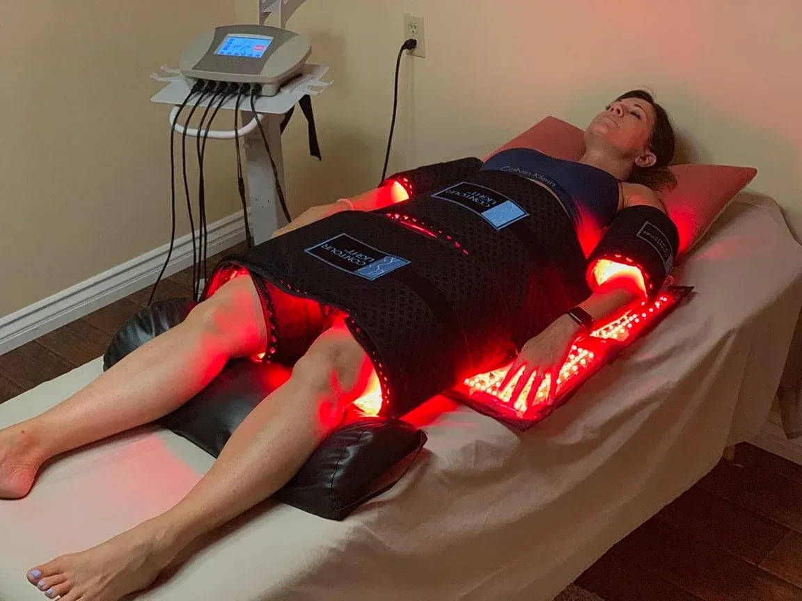 Patient relaxing under Contour Light red-light pads