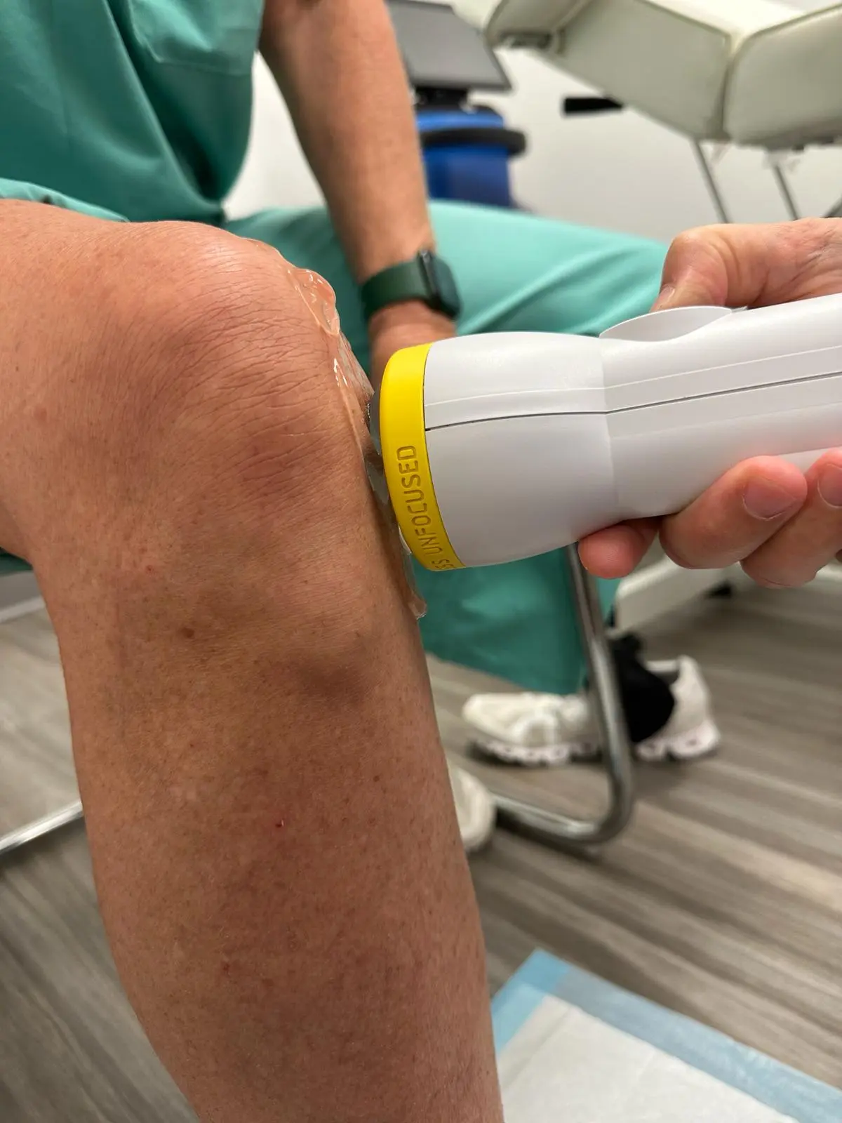 SoftWave therapy applied to a patient's knee at Waters Edge Medical Clinic, St. Petersburg
